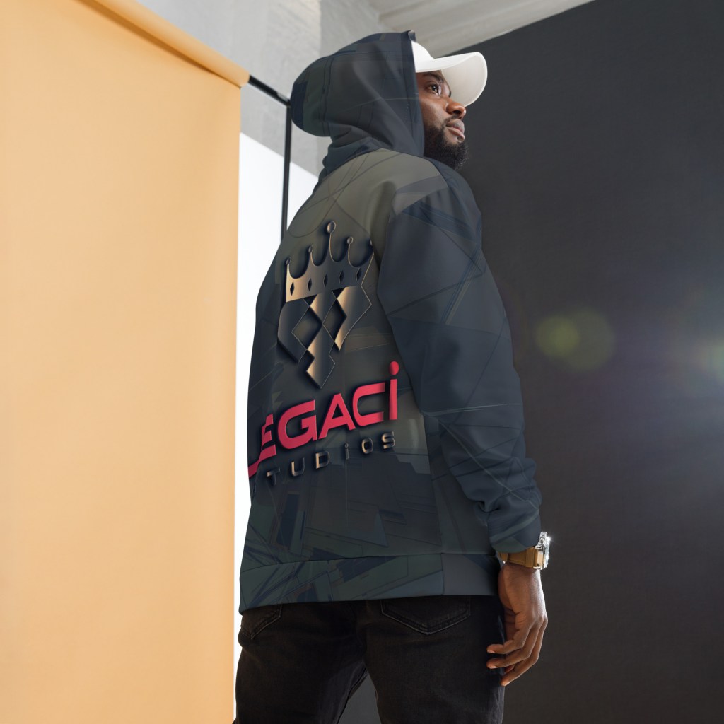 A person wearing a hoodie featuring the Legaci Studios logo, standing against a backdrop with soft lighting.
